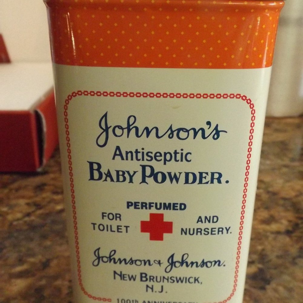 Johnson and Johnsons Baby Powder collectible tin with paperwork